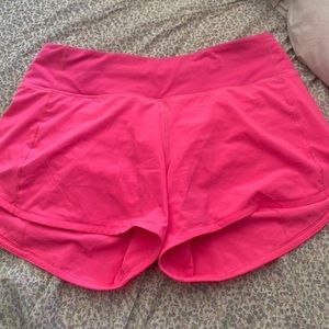 Lululemon pink highlight speed up shorts. 4” tall